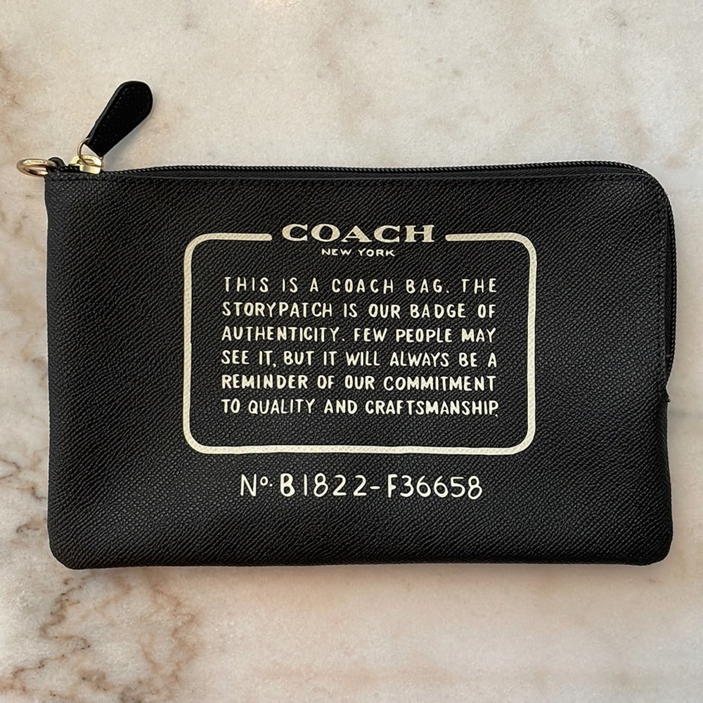 Black coated canvas Coach clutch, authentic never used